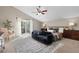 Spacious main bedroom with a cozy sitting area, large windows, and contemporary design at 7570 Windford, Parker, CO 80134
