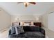 Inviting main bedroom with neutral colors, cozy seating, and ample natural light at 7570 Windford, Parker, CO 80134