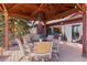 Outdoor gazebo features a dining table, chairs, string lights, and a scenic view at 7570 Windford, Parker, CO 80134