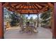 Outdoor gazebo features a dining table, chairs, string lights, and a scenic view at 7570 Windford, Parker, CO 80134