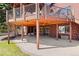 Outdoor patio with string lights underneath an elevated deck with seating at 7570 Windford, Parker, CO 80134