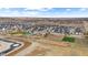 Beautiful aerial of community featuring a playground, baseball field and winding walking paths at 17969 Sky Pilot Ave, Parker, CO 80134