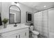 Bright bathroom featuring vanity with a white top and brushed chrome fixtures and white shower curtain at 17969 Sky Pilot Ave, Parker, CO 80134