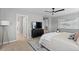 Primary bedroom featuring a ceiling fan, dark wood furniture, and neutral decor at 17969 Sky Pilot Ave, Parker, CO 80134