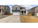 Charming two-story home boasts a two-car garage, stylish exterior, and well-manicured front yard at 17969 Sky Pilot Ave, Parker, CO 80134