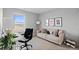 Bright home office with a comfortable chair and sofa, ideal for remote work, relaxation, and creative pursuits at 17969 Sky Pilot Ave, Parker, CO 80134