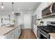 Modern kitchen featuring granite countertops, stainless steel appliances, and hardwood flooring at 17969 Sky Pilot Ave, Parker, CO 80134
