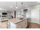 Kitchen island with granite countertop, stainless steel appliances, and open floor plan at 17969 Sky Pilot Ave, Parker, CO 80134
