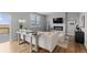 Bright living room with a modern fireplace and deck access, perfect for relaxing at 17969 Sky Pilot Ave, Parker, CO 80134