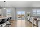 Open concept living room with bar seating, perfect for entertaining guests at 17969 Sky Pilot Ave, Parker, CO 80134