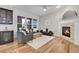 Comfortable living room with hardwood floors, a stone fireplace, and plenty of seating at 8056 E 35Th Ave, Denver, CO 80238