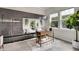Stylish home office featuring custom built-ins, modern desk, and large windows for natural light at 8056 E 35Th Ave, Denver, CO 80238