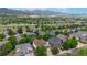Scenic aerial view of a neighborhood with mountain views at 7597 Bison Ct, Littleton, CO 80125
