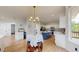 Eat-in kitchen featuring a large island, modern appliances, and ample counter space at 7597 Bison Ct, Littleton, CO 80125
