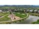 Aerial view of neighborhood park, playground and pond at 7597 Bison Ct, Littleton, CO 80125