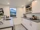 Stylish bar area with marble countertops and a built-in wine cooler at 3961 S Clermont St, Cherry Hills Village, CO 80113