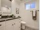 Bathroom featuring a modern vanity and a walk-in shower at 3961 S Clermont St, Cherry Hills Village, CO 80113