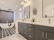 Modern bathroom featuring a soaking tub, double vanity, and sleek fixtures at 3961 S Clermont St, Cherry Hills Village, CO 80113