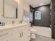 Stylish bathroom featuring a bathtub, white vanity, and modern fixtures at 3961 S Clermont St, Cherry Hills Village, CO 80113