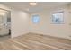 Bright and spacious bedroom with hardwood floors and two windows at 3961 S Clermont St, Cherry Hills Village, CO 80113