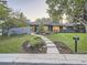 Charming single-story home boasting a manicured front yard, walkway, and inviting curb appeal at 3961 S Clermont St, Cherry Hills Village, CO 80113