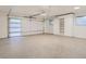 Clean garage with epoxy flooring and built-in storage cabinets at 3961 S Clermont St, Cherry Hills Village, CO 80113