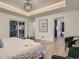 Bright main bedroom with recessed lighting, hardwood floors, and a sliding glass door at 3961 S Clermont St, Cherry Hills Village, CO 80113
