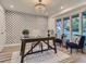 Stylish home office featuring patterned wallpaper, natural light, and hardwood floors at 3961 S Clermont St, Cherry Hills Village, CO 80113