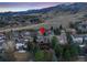 Discover this home nestled among trees, boasting an outdoor deck, with mountain views, in a peaceful neighborhood at 34 Amaranth Dr, Littleton, CO 80127