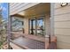 Cozy balcony features wood railing, metal screen and a view of the surrounding neighborhood at 34 Amaranth Dr, Littleton, CO 80127