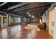 Open basement area with painted ceiling, polished concrete floors, and potential for customizable living space at 34 Amaranth Dr, Littleton, CO 80127