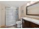 Well-lit bathroom features a glass-enclosed shower, modern vanity, and neutral tones for a clean, updated look at 34 Amaranth Dr, Littleton, CO 80127