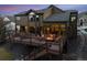 Enjoy mountain views from this home's spacious deck with a fire pit and seating, perfect for outdoor entertaining at 34 Amaranth Dr, Littleton, CO 80127