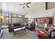 Open concept living room boasts an abundance of natural light and seamless flow to the kitchen at 34 Amaranth Dr, Littleton, CO 80127
