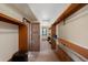 Spacious walk-in closet boasts wood shelving and room for ample storage; perfect for organization at 34 Amaranth Dr, Littleton, CO 80127