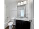 Clean bathroom with a tub and shower combination and a vanity with a granite countertop at 1826 Sunshine Ave, Longmont, CO 80504