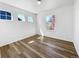 Bright bedroom with laminate wood floor, and dual windows allowing natural light at 1826 Sunshine Ave, Longmont, CO 80504