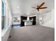 Bright and airy open concept living room and kitchen with dark cabinetry, hardwood floors and large windows at 1826 Sunshine Ave, Longmont, CO 80504