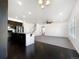 Bright, open living space featuring a kitchen island, ample natural light, and modern appliances at 1826 Sunshine Ave, Longmont, CO 80504