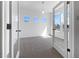 Bright office space with ample natural light, neutral carpeting, and a view of the outdoors at 1826 Sunshine Ave, Longmont, CO 80504