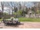 Spacious backyard with patio, dining set, swing set, and well-manicured lawn at 121 N Marion St, Denver, CO 80218