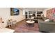Finished basement with a comfortable seating area, play area, and ample storage at 121 N Marion St, Denver, CO 80218