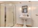 Bathroom featuring pedestal sink, modern lighting fixtures, and standing shower at 121 N Marion St, Denver, CO 80218