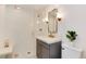 Bright bathroom featuring a glass shower, modern fixtures, and a stylish vanity at 121 N Marion St, Denver, CO 80218