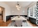 Bright dining room featuring modern lighting, neutral decor, and ample space at 121 N Marion St, Denver, CO 80218