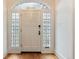 Elegant white front door framed by stained-glass windows and an arched transom window at 121 N Marion St, Denver, CO 80218