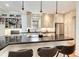 Bright kitchen features a large island with bar seating, built-in shelving, and stainless steel appliances at 121 N Marion St, Denver, CO 80218