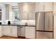 Beautiful kitchen with stainless steel appliances, light cabinetry, and granite countertops at 121 N Marion St, Denver, CO 80218