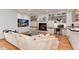 Cozy living room with custom built-ins, a fireplace, and a comfortable, oversized couch at 121 N Marion St, Denver, CO 80218