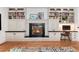 Living room showcasing the fireplace, a beautiful mantel, and custom built-in shelving at 121 N Marion St, Denver, CO 80218